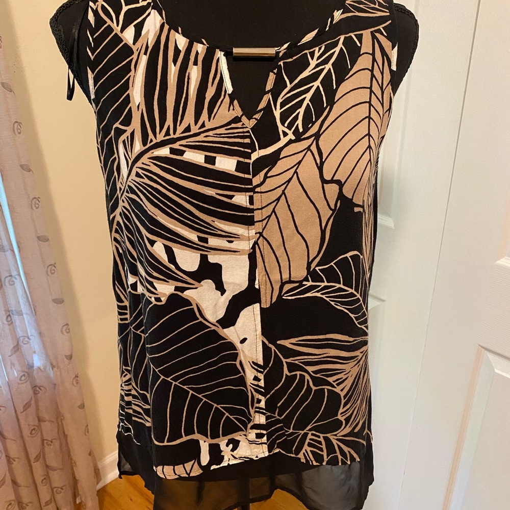 Gently used sleeveless blouse.